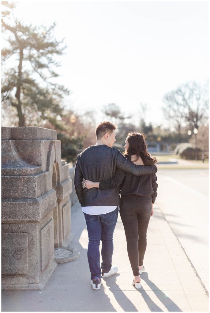 Couple walking across bridge