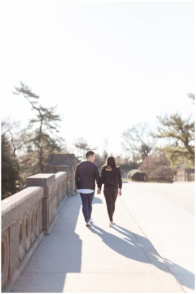 Couple walking across bridge